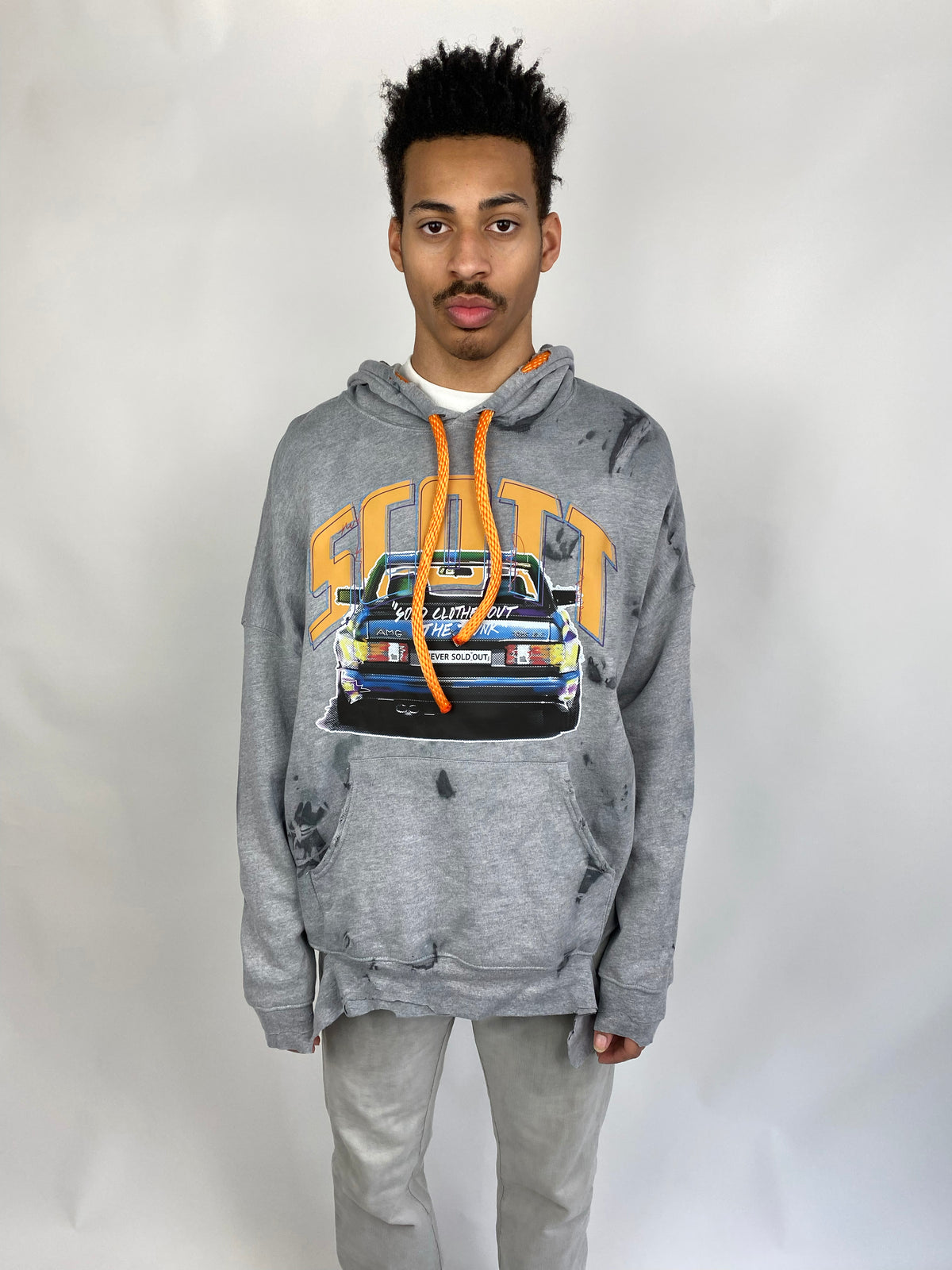 Unisex hand-dyed and distressed Hoodie with SCOTT branding and car graphic print. An oversized hood with signature rope for function.